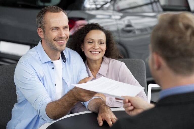 happy-couple-car-showroom-dealership